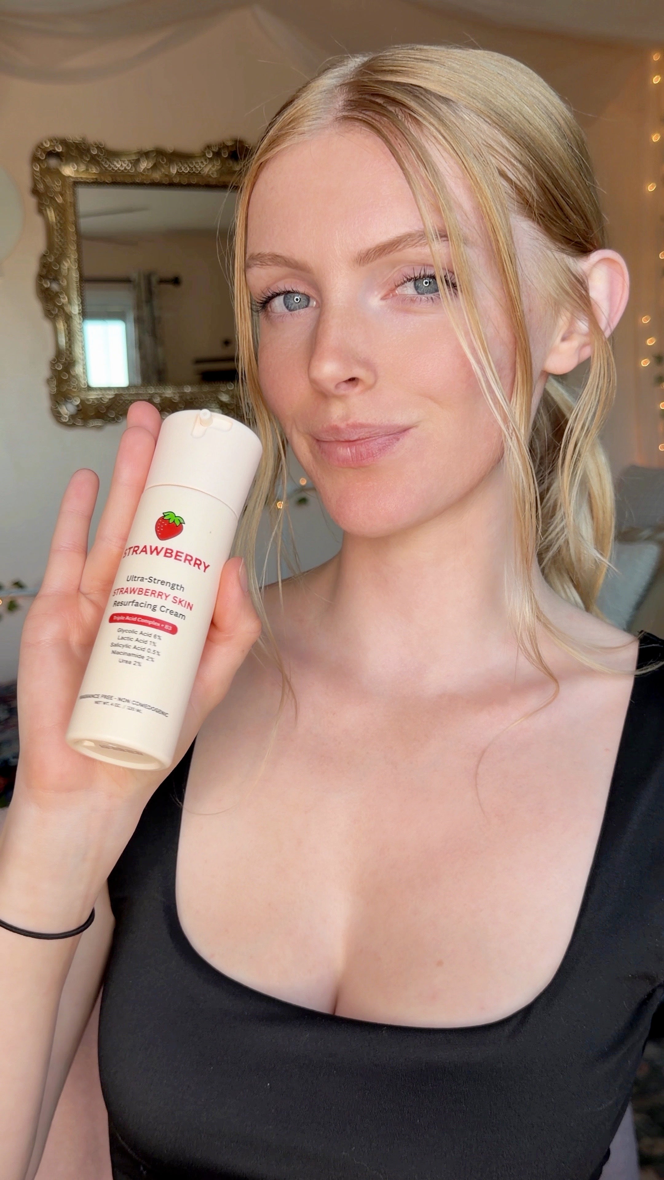 Woman holding the Strawberry Ultra-Strength Resurfacing Cream