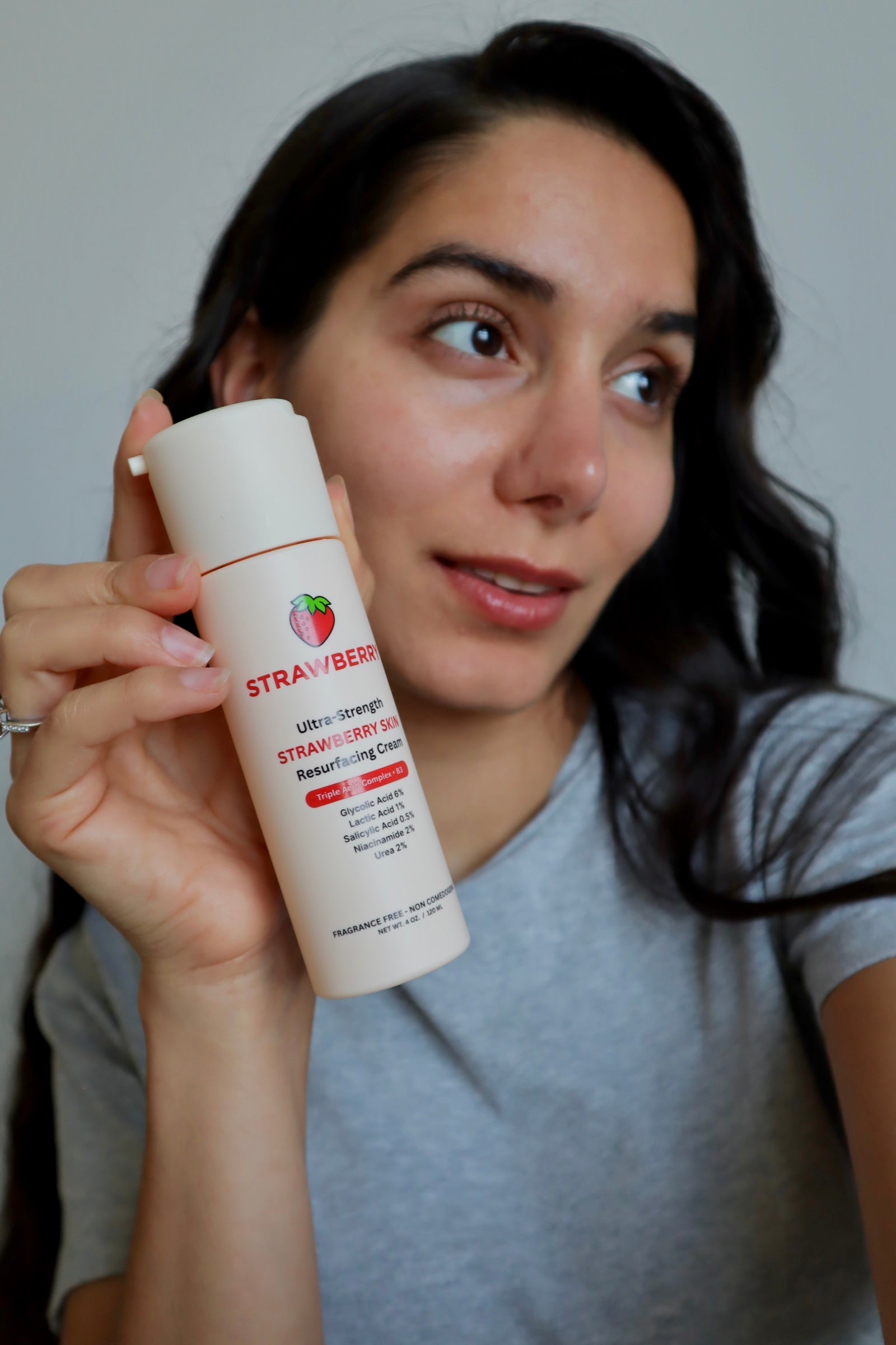 Sara holding the Strawberry resurfacing cream